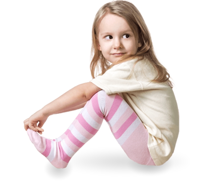 Young girl sitting and grabbing her feet