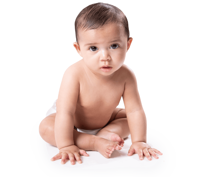 A male baby sitting, looking at the camera